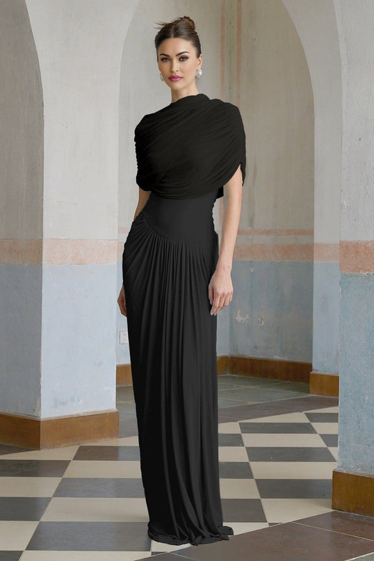 A black asymmetric maxi dress with pleated details and an uneven hemline worn by a female model