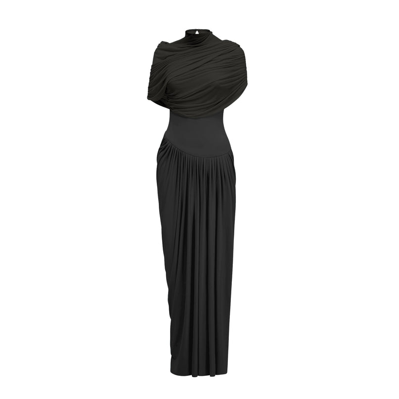 A black asymmetric maxi dress with pleats and an uneven hemline worn by a model standing against a plain background