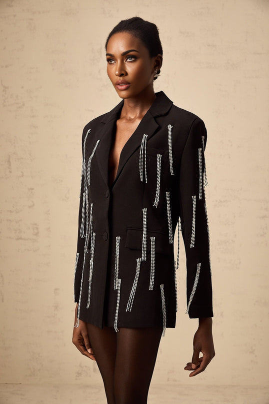 A black blazer adorned with crystal tassels featuring a sophisticated design and luxurious embellishments
