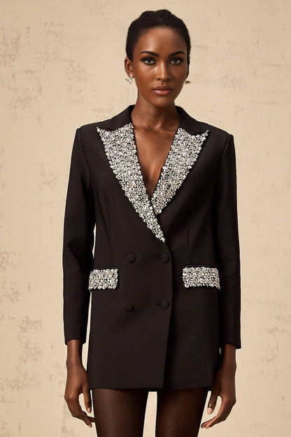 A black blazer adorned with sparkling crystal embellishments featuring a tailored fit and elegant design