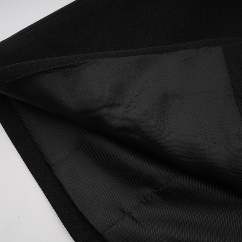 A black blazer with a bow detail and cutout design named Justine