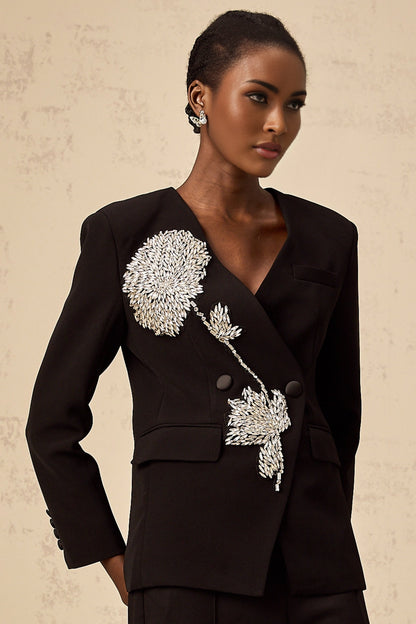 A black blazer with a floral pattern featuring embellished flower motifs named Therese