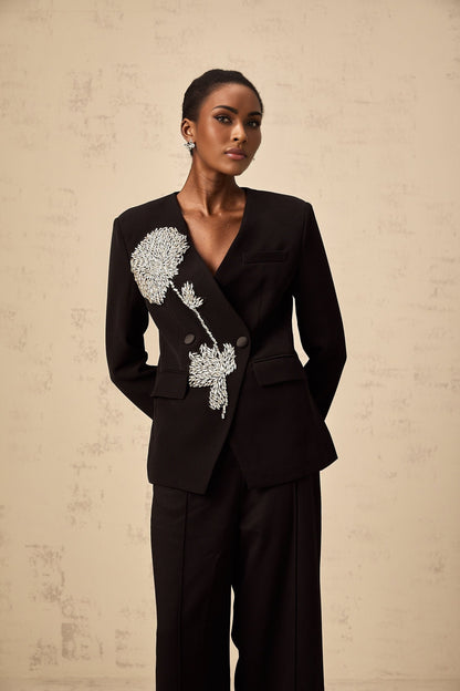 A black blazer with a floral pattern featuring embellished flower motifs named Therese