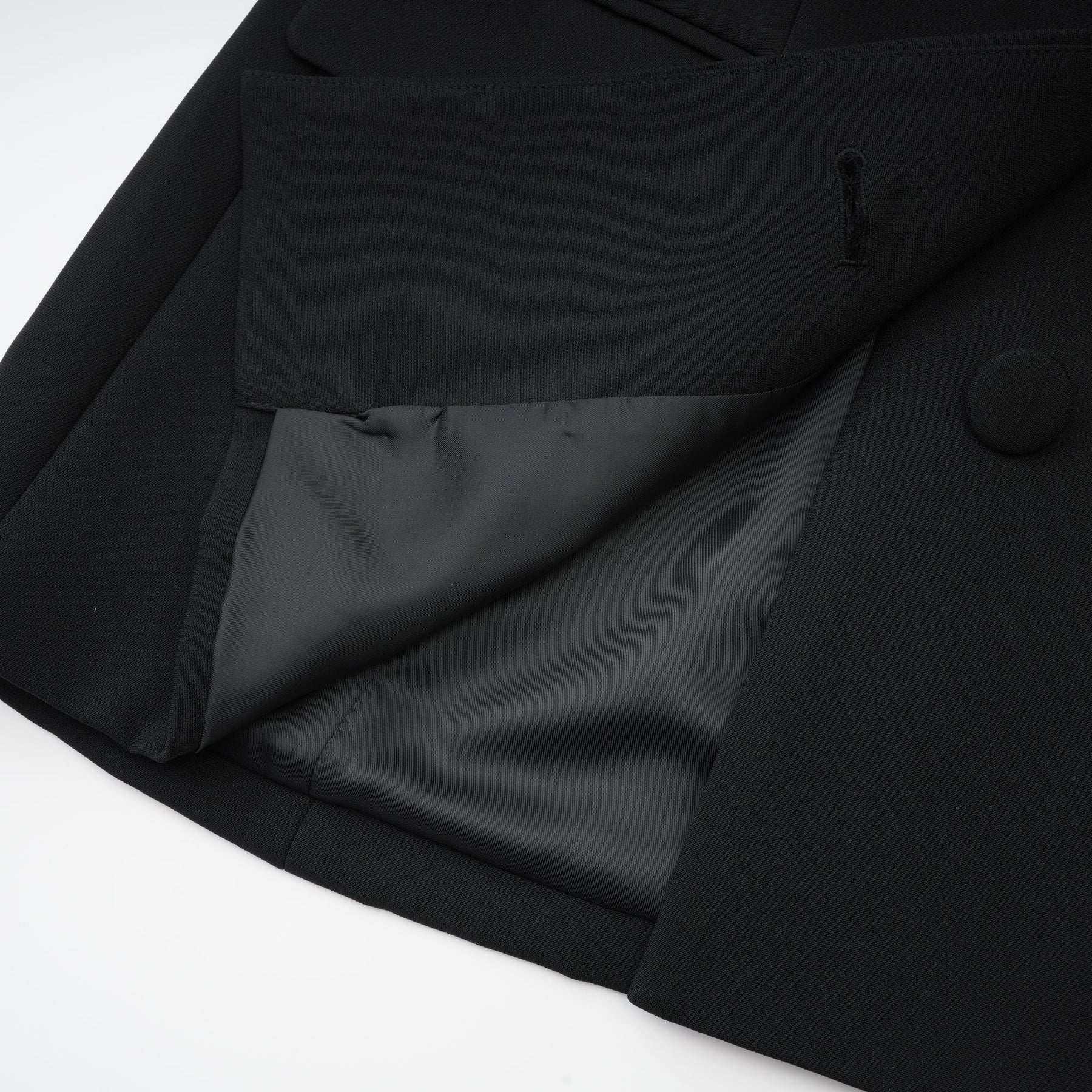 Black dress with long sleeves notched lapels scoop back buttoned cuffs fitted waistline crystal embellishment and front button fastening Made of 100% Polyester