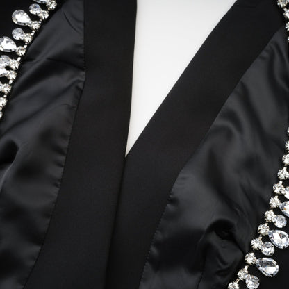 Classic black dress with stylish long sleeves and crystal embellishment