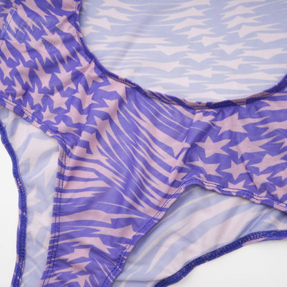 black bodysuit with sheer mesh fabric adorned with white star prints covering the entire garment