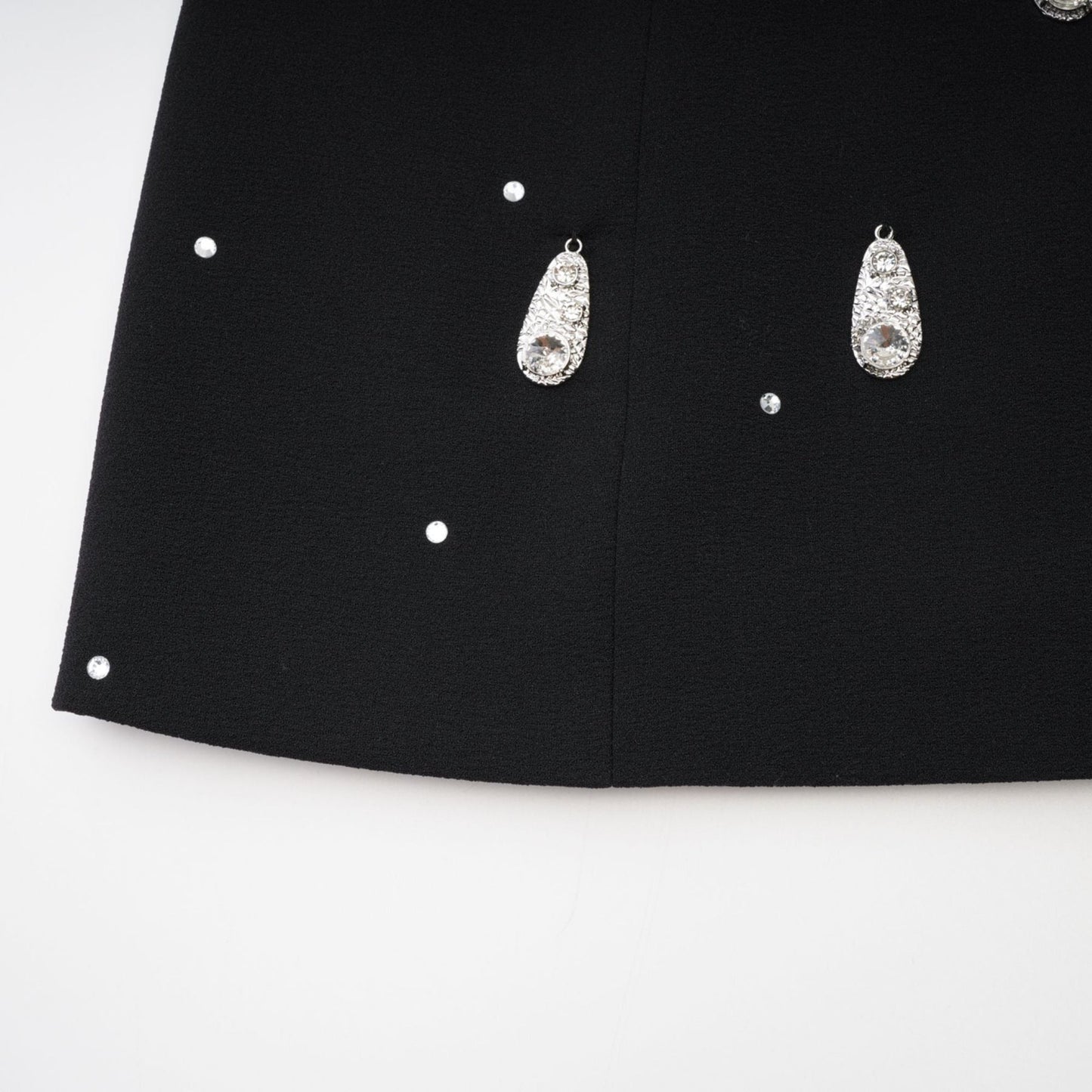 Black dress with front bowknot detailing adorned with embellishments rear zip fastening and made of 100% Polyester