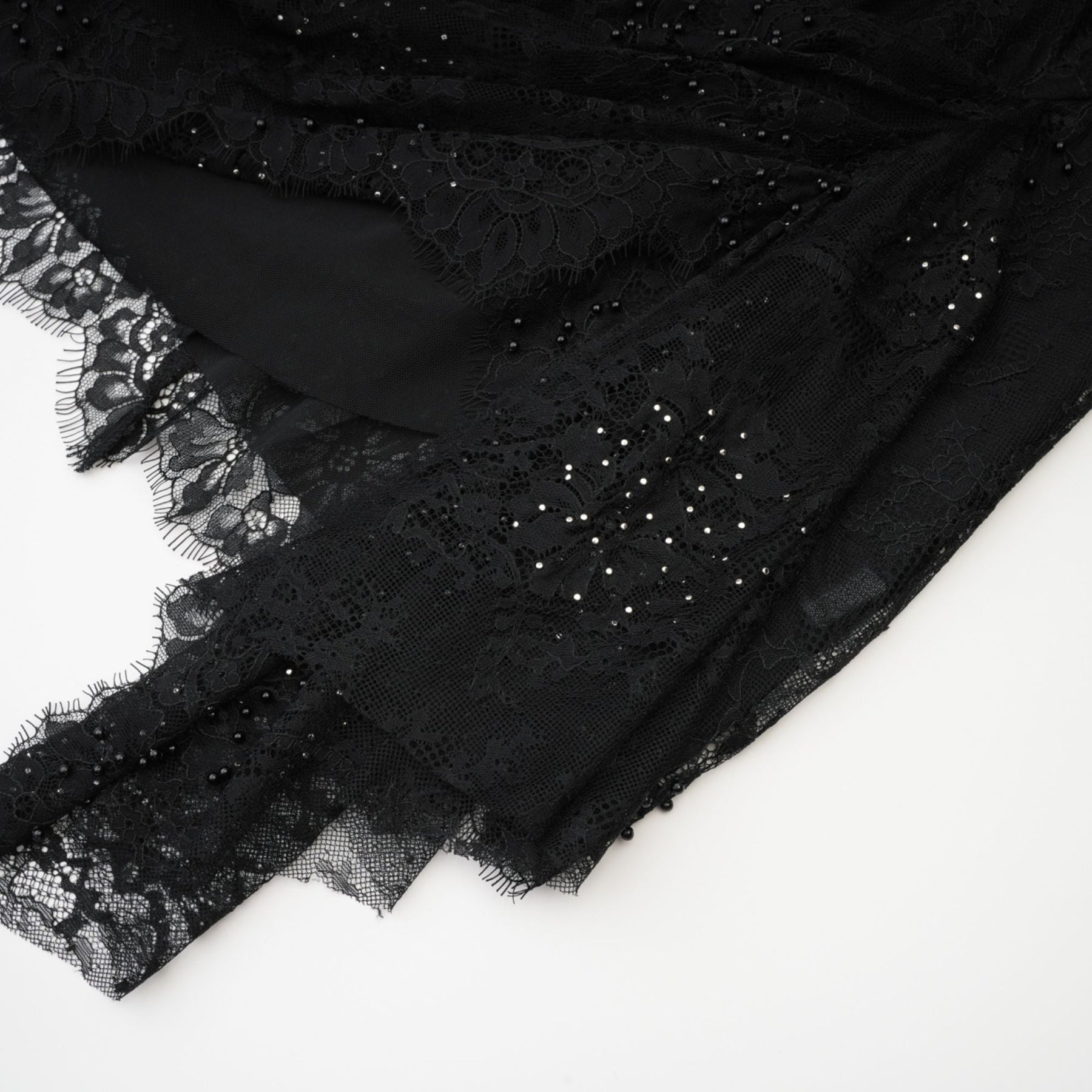Black offtheshoulder dress with mesh lace pearl accents and ribbon detail mini length