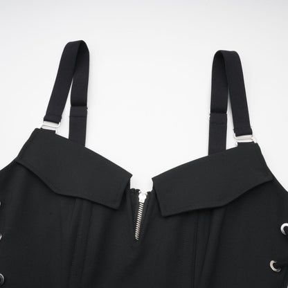 Sleeveless black dress with Vneck boned bodice adjustable straps rear zip hook closure flap pockets thighlength 98% Organic Cotton 2% Elastane