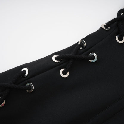 Black sleeveless dress with Vneck boned bodice and chest flap pockets Made of 98% Organic Cotton and 2% Elastane