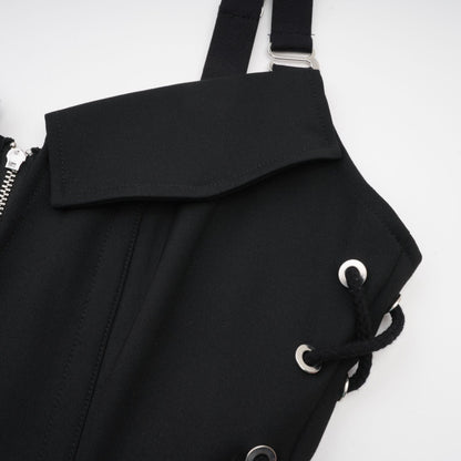 Black sleeveless dress with a Vneck and structured boned bodice Adjustable and detachable shoulder straps stylish chest flap pockets and thighlength coverage Made of 98% Organic Cotton and 2% Elastane Wrapped in designer rear zip and side hook and eye closure