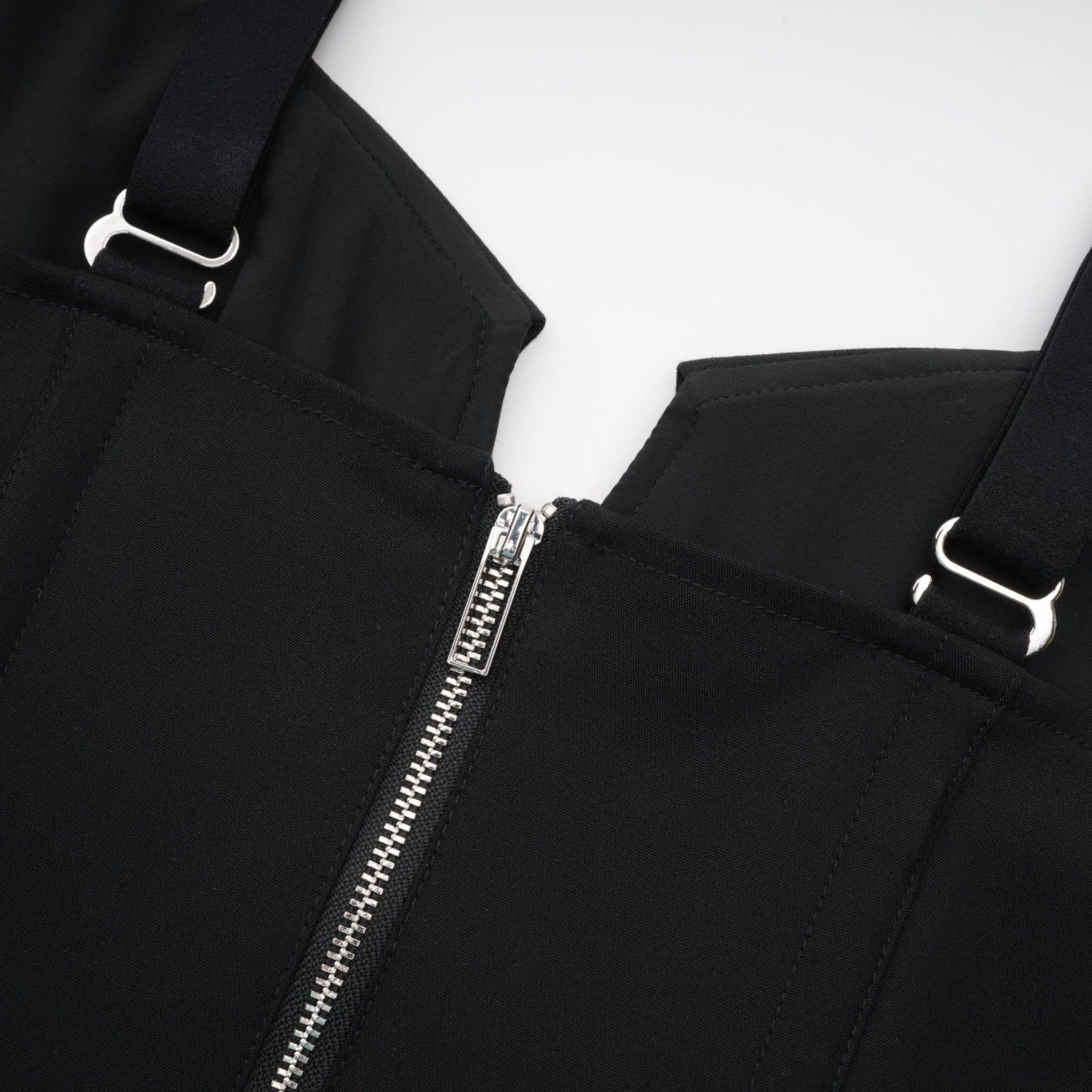 Black sleeveless dress with Vneck boned bodice adjustable straps rear zip fastening chest flap pockets and thighlength hem Made of 98% Organic Cotton and 2% Elastane