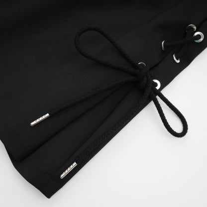 Black sleeveless dress with Vneck boned bodice adjustable straps rear zip chest pockets and thighlength coverage in organic cotton and elastane blend