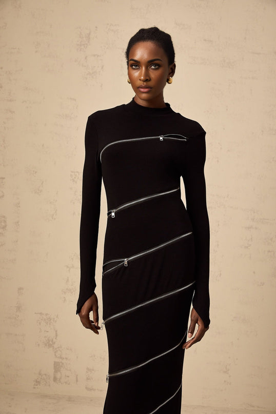 A black fitted maxi dress with a zipper detail named Costanza