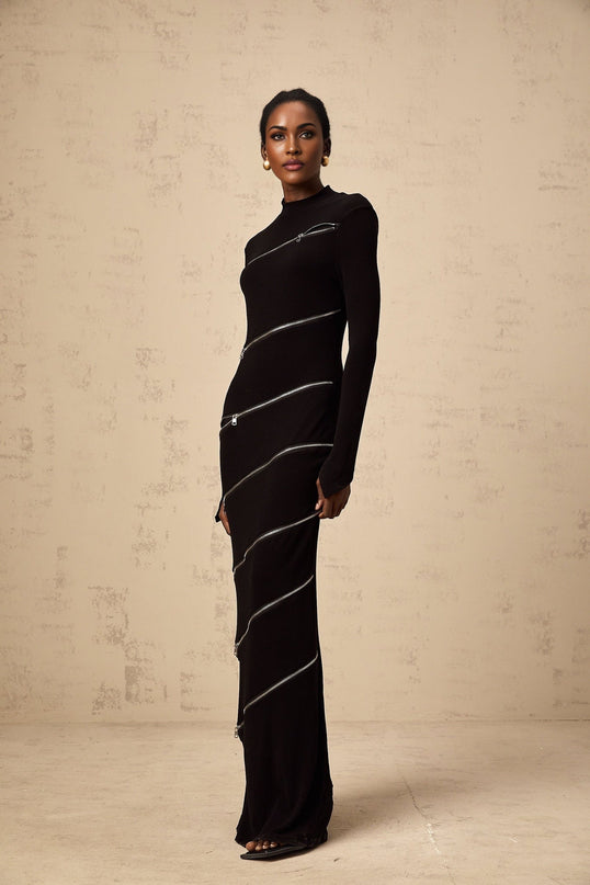 A black fitted maxi dress with zipper details named Costanza