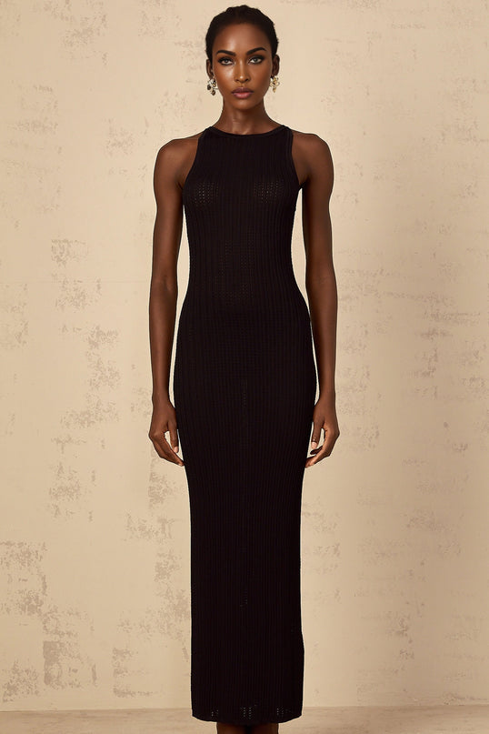 A black fitted ribbed knit maxi dress on a plain background