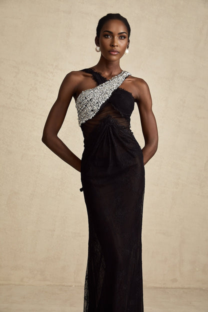 A black floorlength maxi dress with a crossover bodice adorned with crystal embellishments