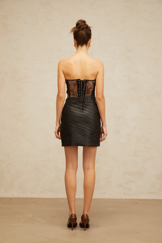A black floral lace corset paired with a matching leather skirt forming a stylish two piece set named Gabrielle