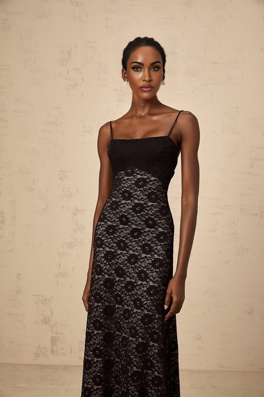 A black floral lace maxi dress with an open back design named Zelie