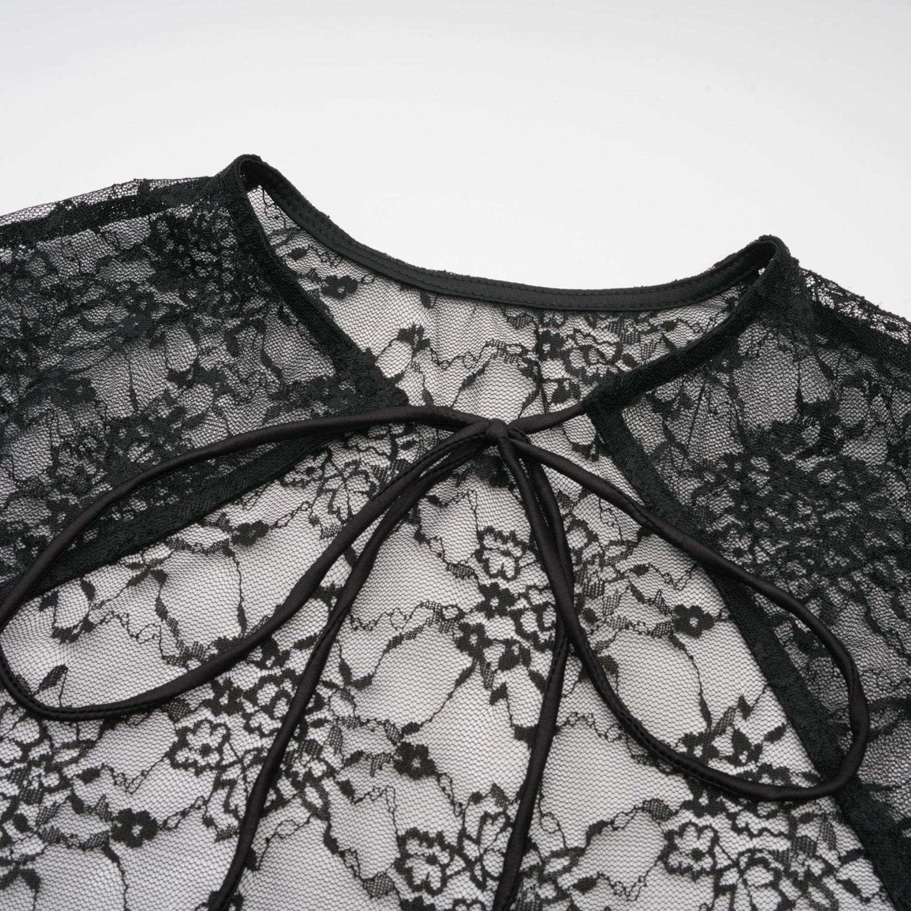 A black floral lace sleeveless vest and matching dress set named Louise