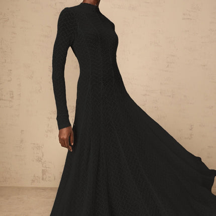 A black fulllength maxi dress with a wavy lace pattern covering the entire garment creating an elegant and intricate design
