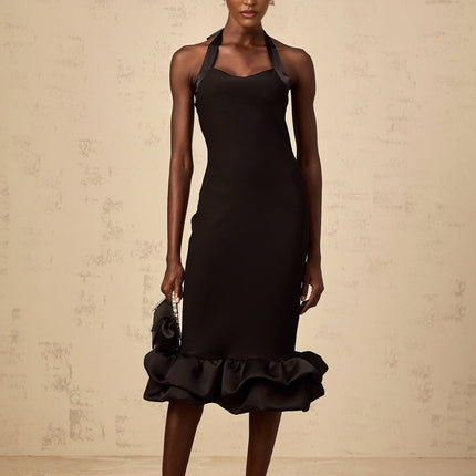 A black halterneck midi dress with a bubble hem featuring a fitted bodice and flared skirt silhouette