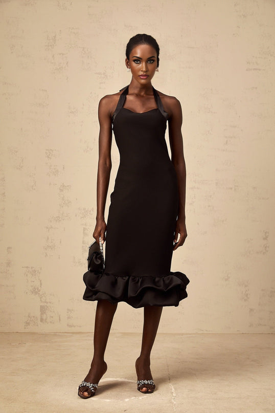A black halterneck midi dress with a bubble hem featuring a fitted bodice and flared skirt silhouette