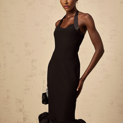 A black halterneck midi dress with a bubble hem featuring a fitted bodice and flared skirt silhouette