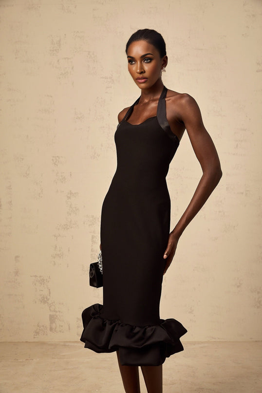 A black halterneck midi dress with a bubble hem featuring a fitted bodice and flared skirt silhouette