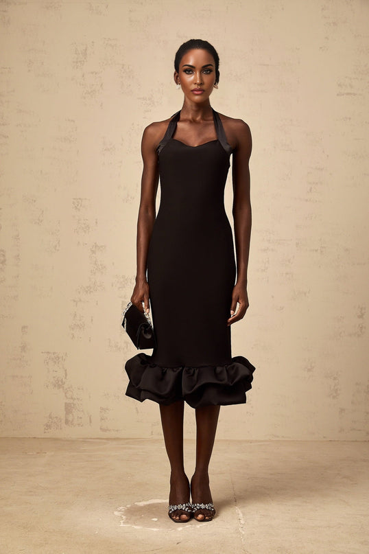 A black halterneck midi dress with a bubble hem featuring a fitted bodice and flared skirt silhouette