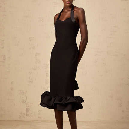 A black halterneck midi dress with a bubble hem featuring a fitted bodice and flared skirt