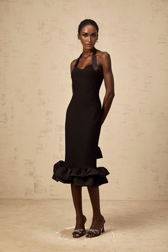 A black halterneck midi dress with a bubble hem featuring a fitted bodice and flared skirt