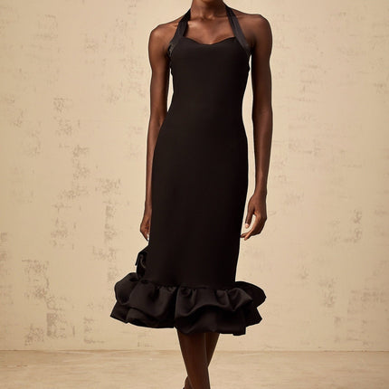 A black halterneck midi dress with a bubble hem featuring a fitted bodice and flared skirt
