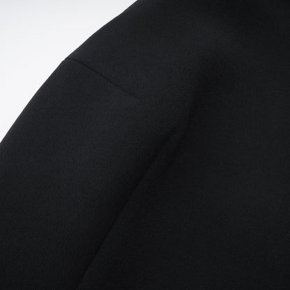 Black dress with elegant sleeveless cut halter neck and golden button design  chic and glamorous style thigh length