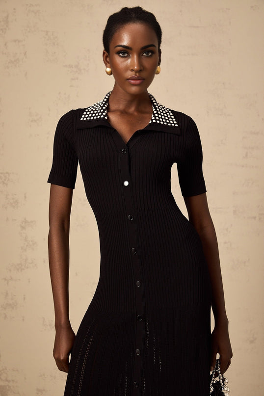 A black knit midi dress with studded details named Laetitia shown on a mannequin or model