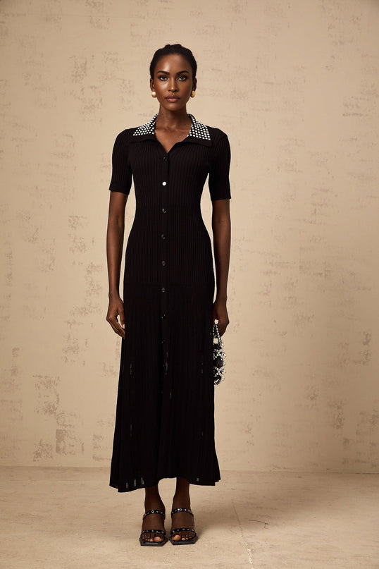 A black knit midi dress with studded embellishments named Laetitia featuring a fitted silhouette and long sleeves