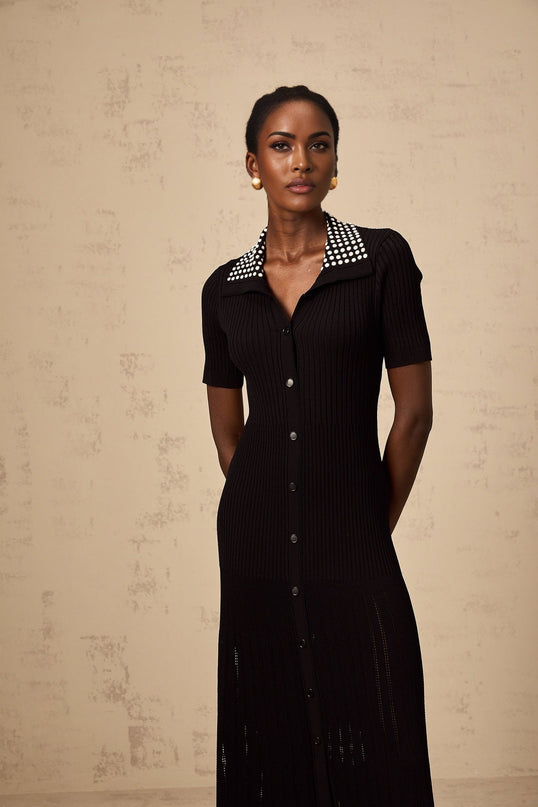 A black knit midi dress with studded embellishments named Laetitia featuring a sleek silhouette and textured detailing