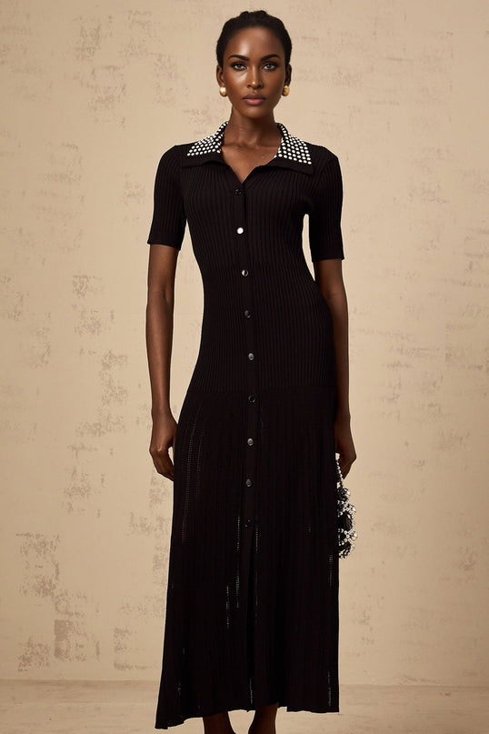 A black knitted midi dress with studded embellishments named Laetitia featuring a fitted silhouette and long sleeves