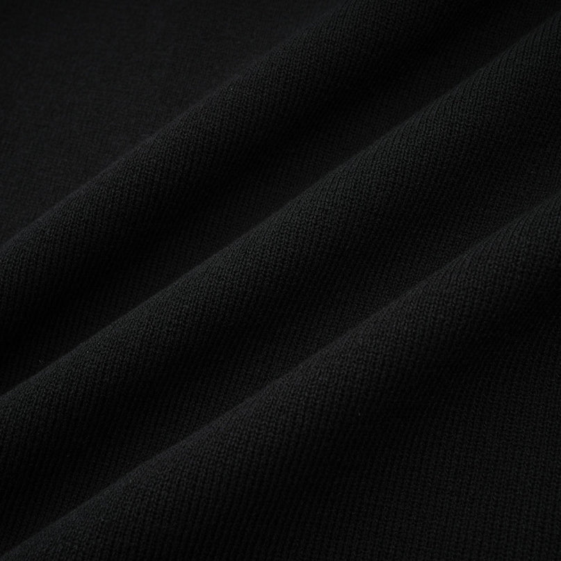 A black knitted mini dress with embellishments and ruffled details named Fabienne