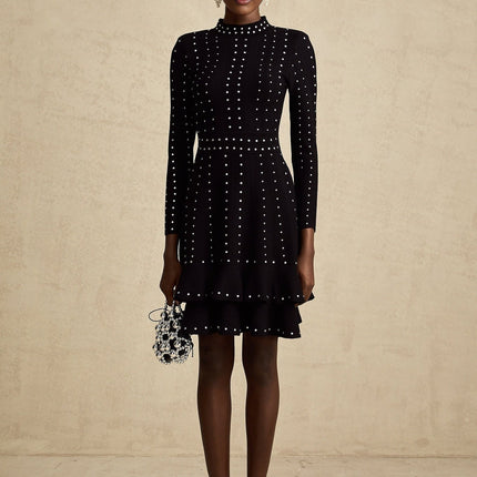 A black knitted mini dress with ruffles and embellishments named Fabienne