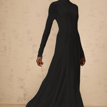 A black lace maxi dress with a wavy pattern design called Athena featuring a full length skirt and delicate lace details throughout