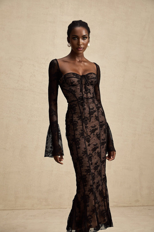 A black lace maxi dress with flared sleeves and a fitted waist extending to a full length skirt