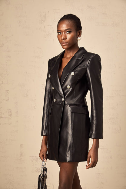 A black leather blazer mini dress on a mannequin or model featuring a tailored fit lapels and a short hemline