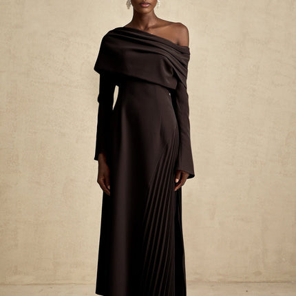 A black long maxi dress with a high slit and pleated design suitable for Valentines Day occasion
