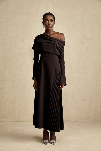 A black long maxi dress with a high slit and pleated design suitable for Valentines Day occasion
