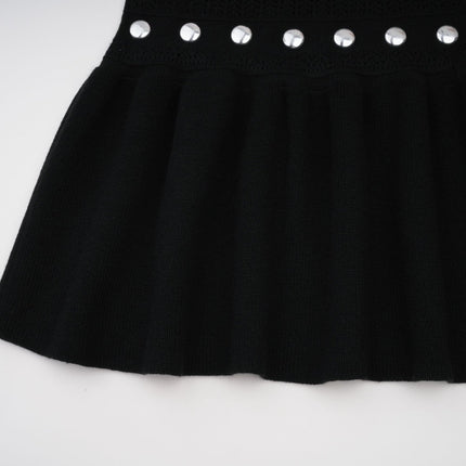 A black long maxi dress with crochet knit pattern and studded details designed by Chloe