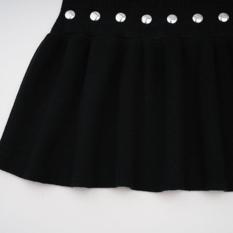 A black long maxi dress with crochet knit pattern and studded details designed by Chloe