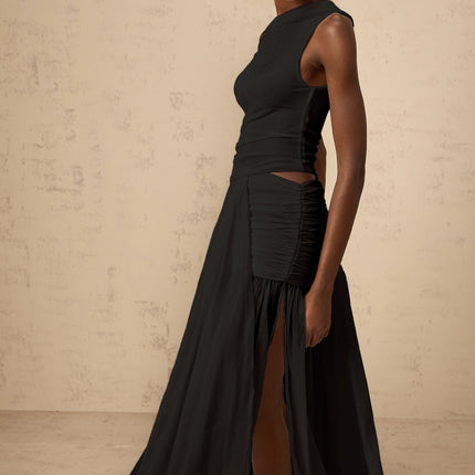 A black maxi dress with a single shoulder strap and shirred panel detailing