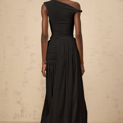 A black maxi dress with a single shoulder strap and shirred panels along the body featuring a sleek and elegant design