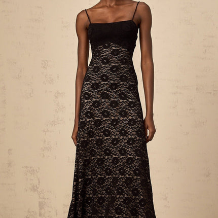 A black maxi dress with an open back featuring floral lace pattern and a long flowing silhouette